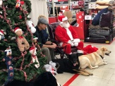Myla and Alan with Santa and their furry family